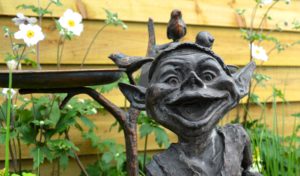 Metal garden goblin bird bath
