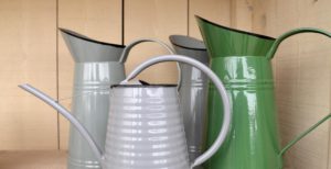 Vintage milk jugs and watering can