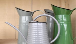 Collection of grey and green metal jugs