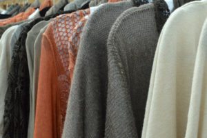 Ladies knitwear hanging on a rail