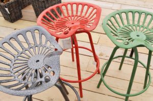 3 metal stools in grey, red and green