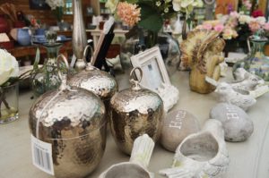 Metal vases. Stones with "Home" engraved